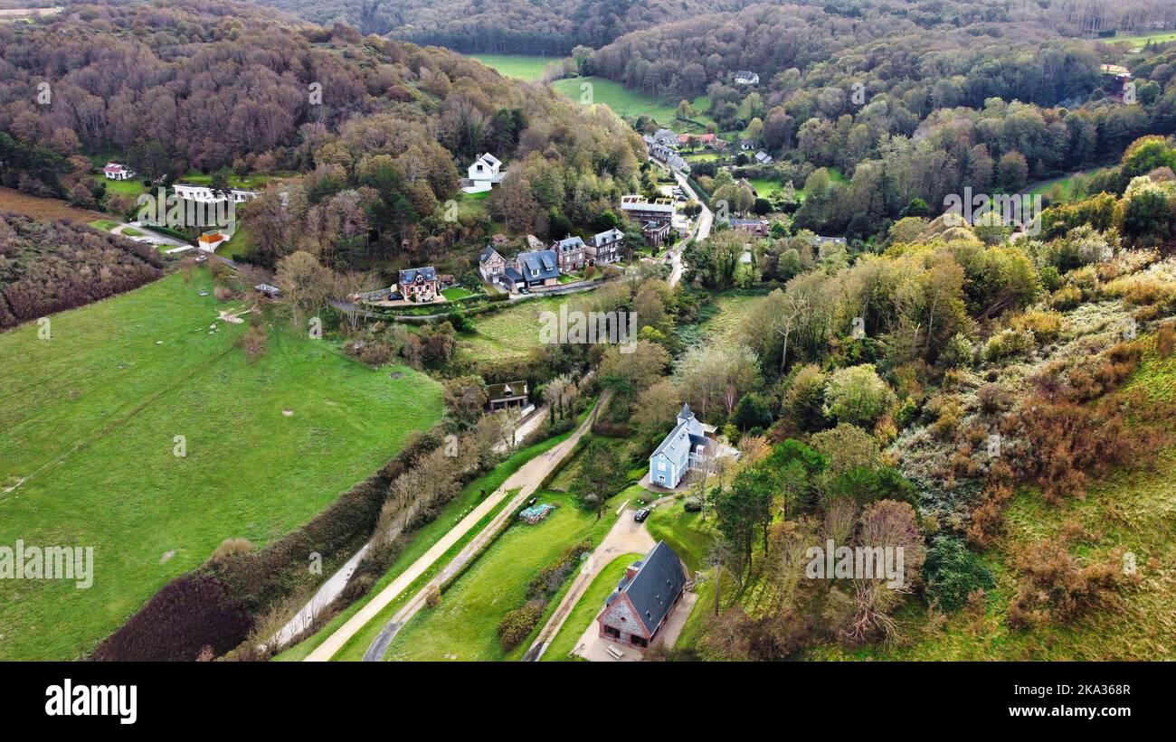 An aerial view of houses in a forest under the sunlight Stock Photo - Alamy