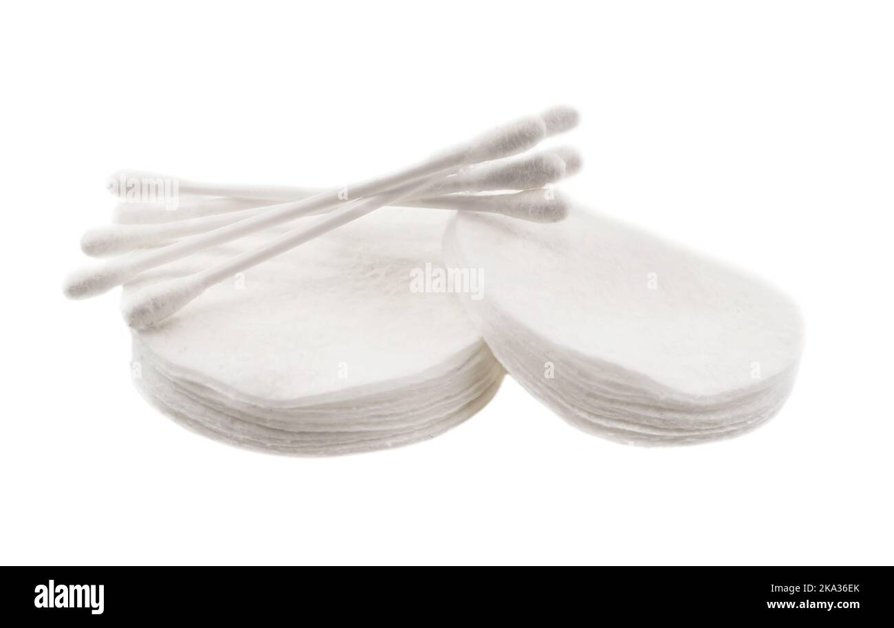 Cotton pads and ear sticks on a white background closeup. Cotton wool