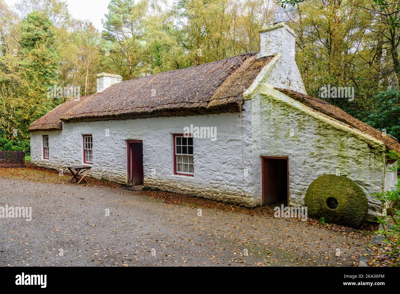 Very small, three roomed,  Irish thatched cottage, common among farm workers in the 1800s 19th century Stock Photo