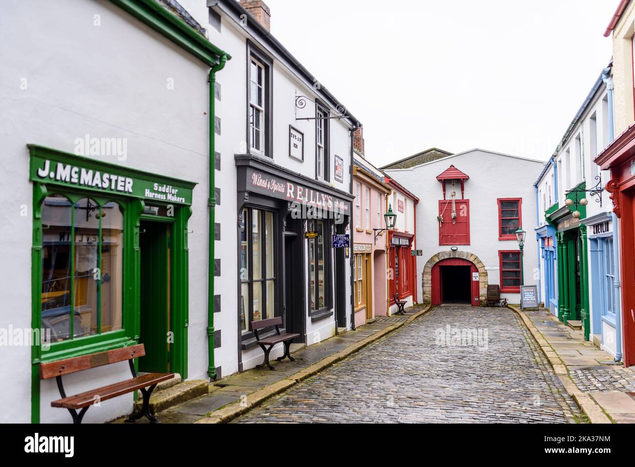 Shops in a street of a very old Irish town from the 19th century 1800s. Stock Photo