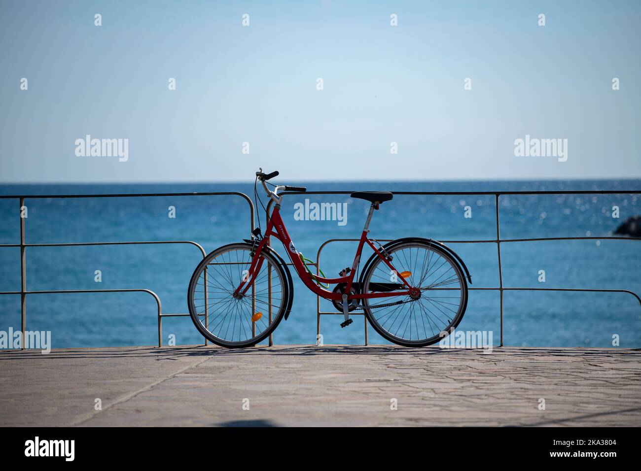 Lavagna Chiavari Riviera Liguria Italy Sept 2022 Bicycle resing against railings above beach and the sea. Stock Photo