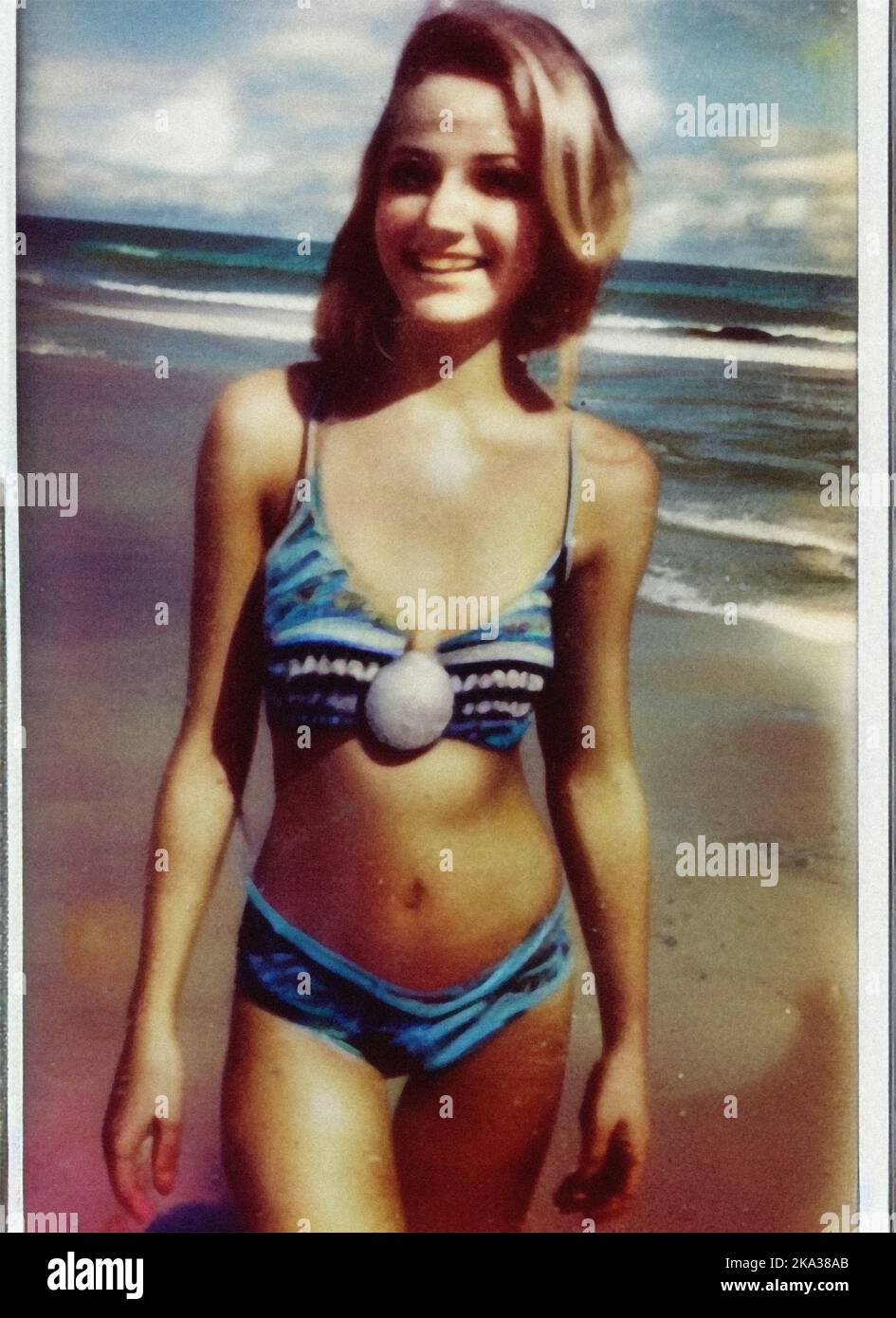 A young woman in a swimsuit on the beach, vintage retro photo Stock Photo