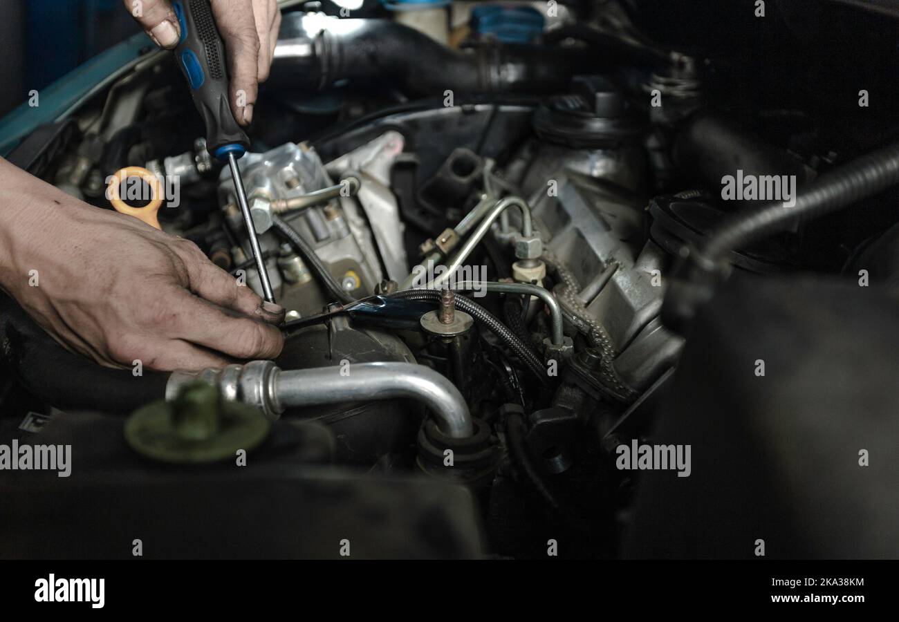 Mechanic measuring voltage of car battery Stock Photo Alamy