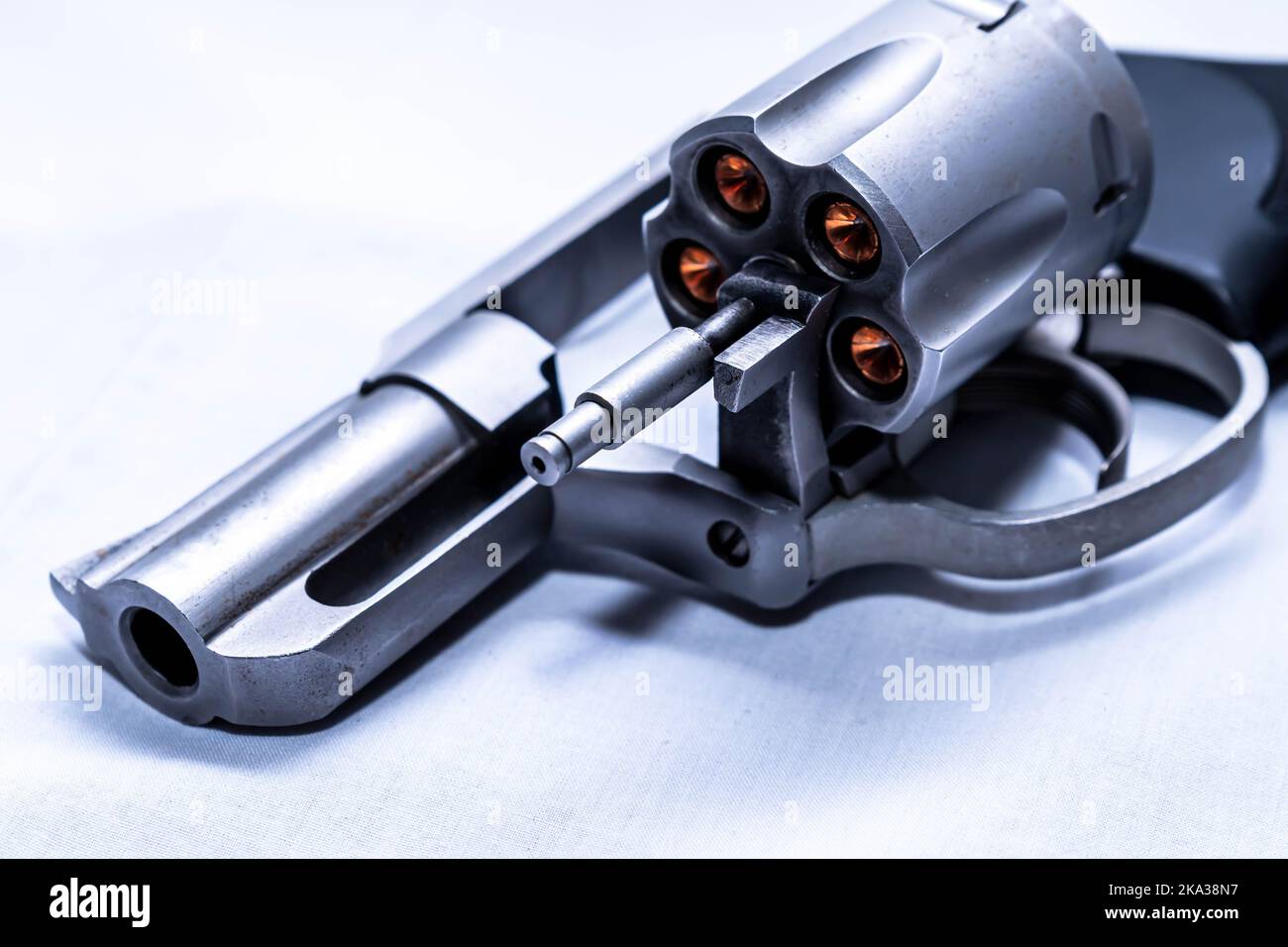 A 357 magnum revolver with its cylinder open and loaded with hollow ...