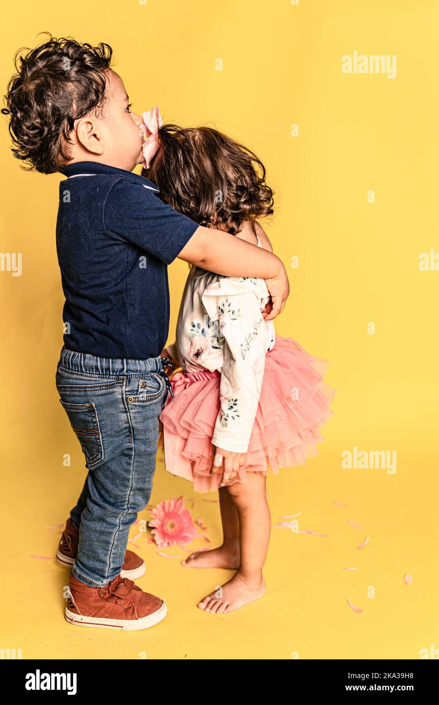 little boy kissing in the forehead to little girl with a tutu Stock Photo Alamy