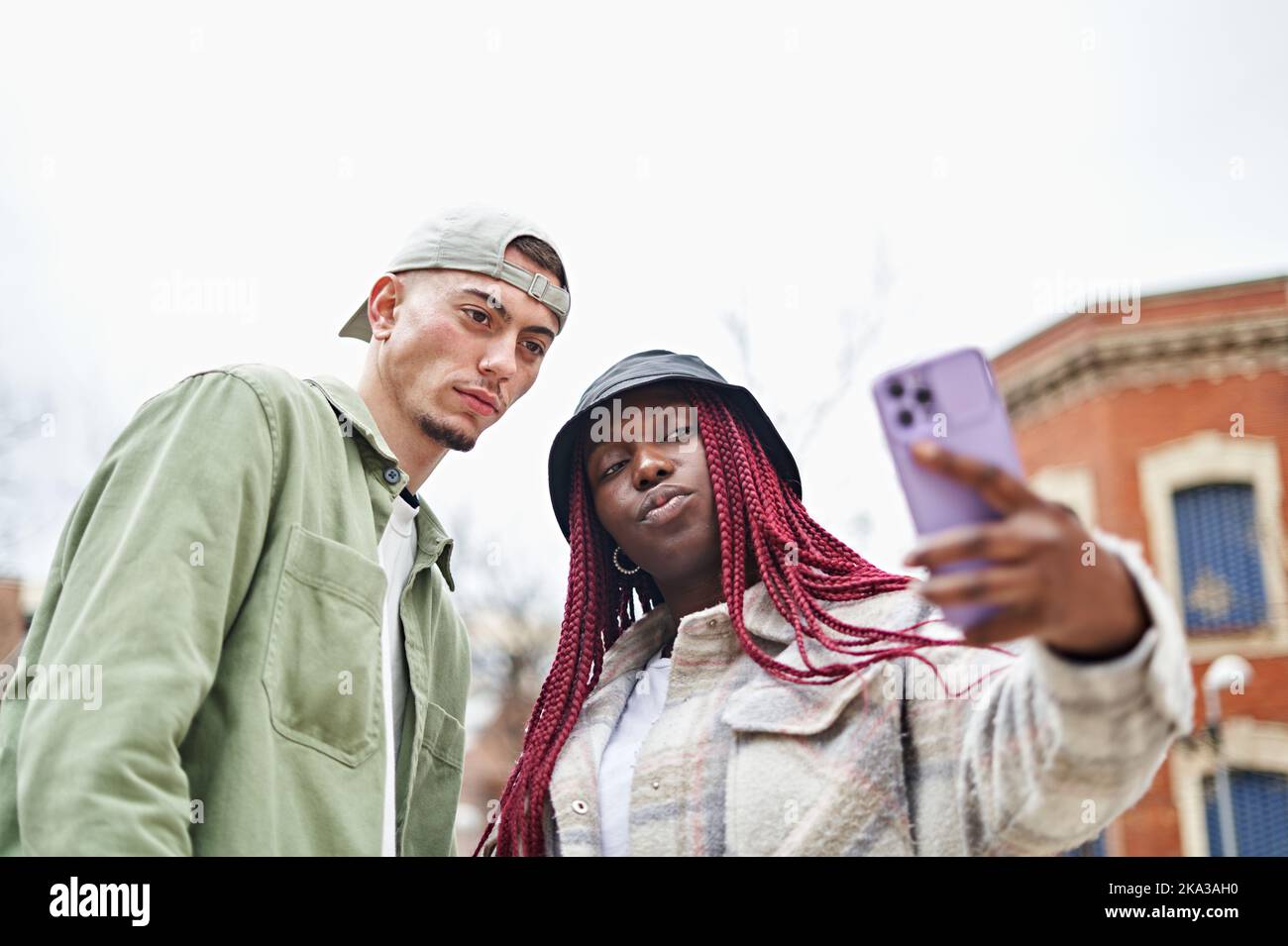 Happy Multiethnic Couple Taking Selfie Stock Photo