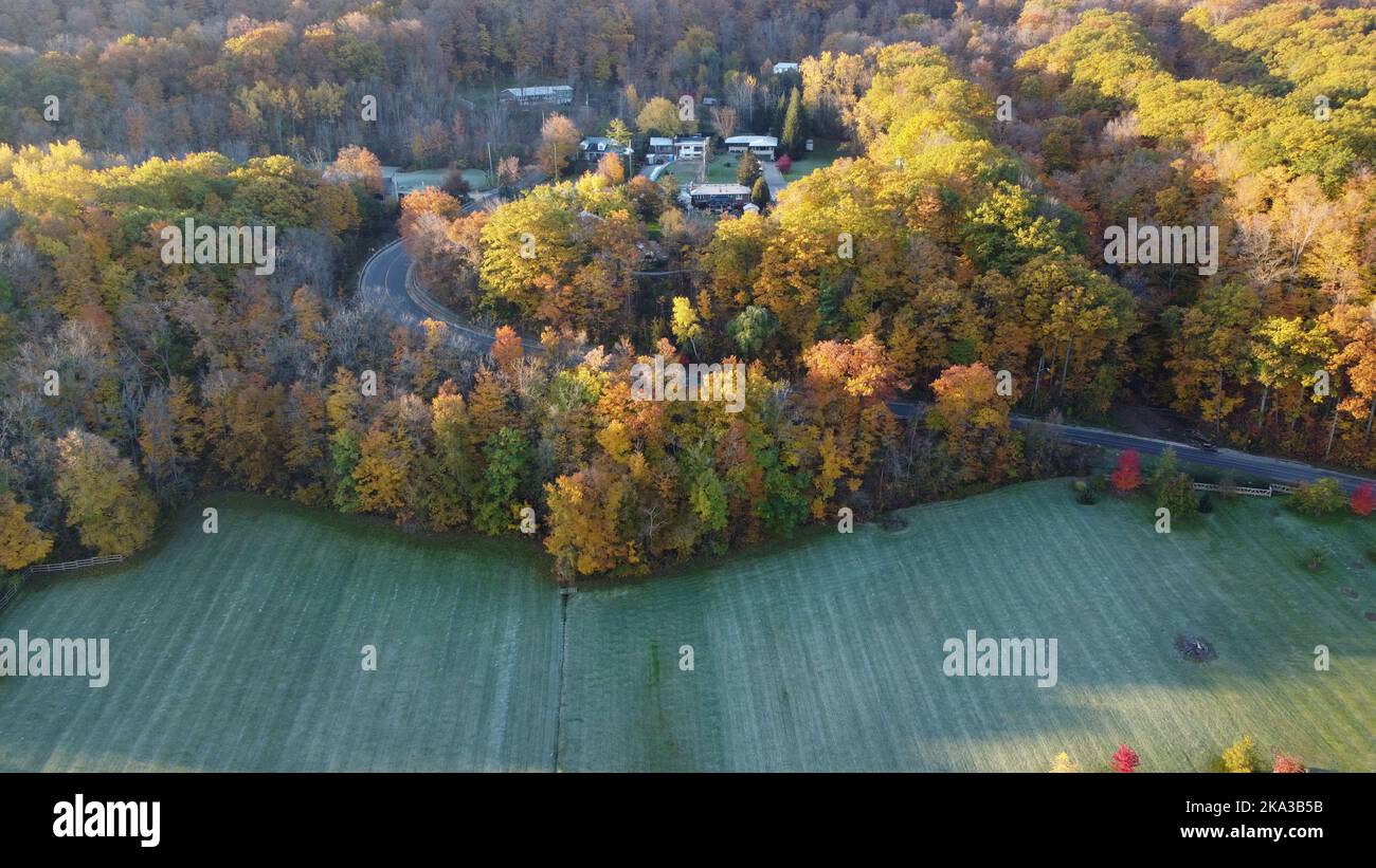An aerial view of a small village near a forest in the countryside ...