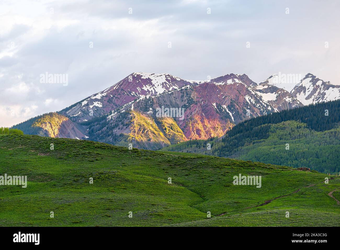 Mt Crested Butte Colorado in summer with view of colorful sunrise on