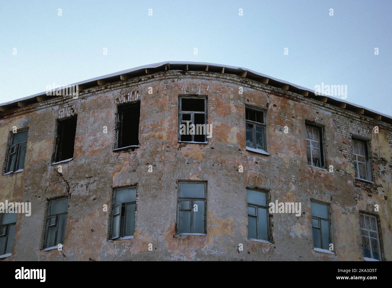 A low angle shot of the exterior design of an abandoned building with ...