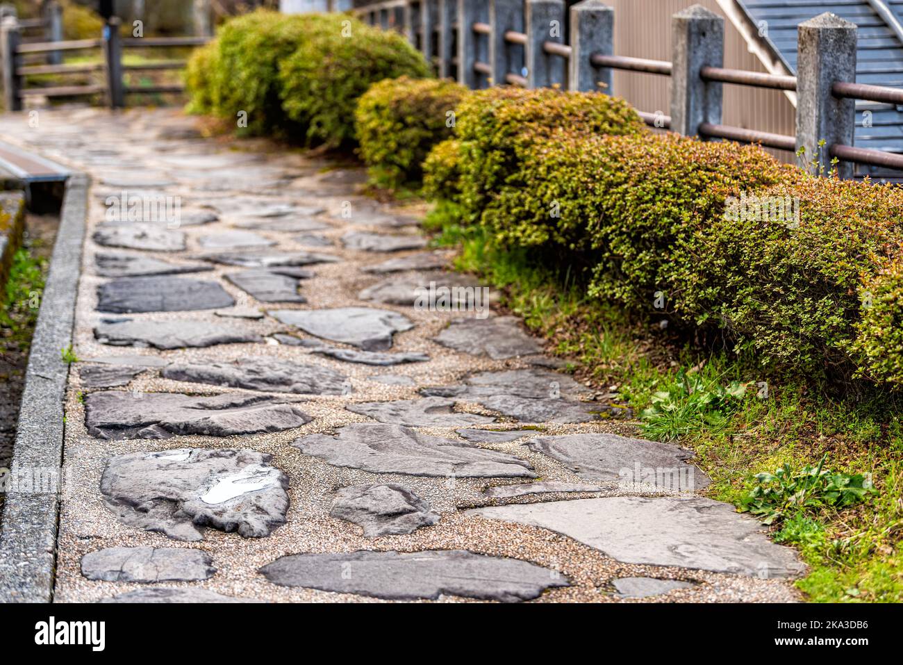 Stone paved path footpath in Takayama, Japan at Higashiyama walking course in historic city of Gifu Prefecture by Tounin temple shrines Stock Photo