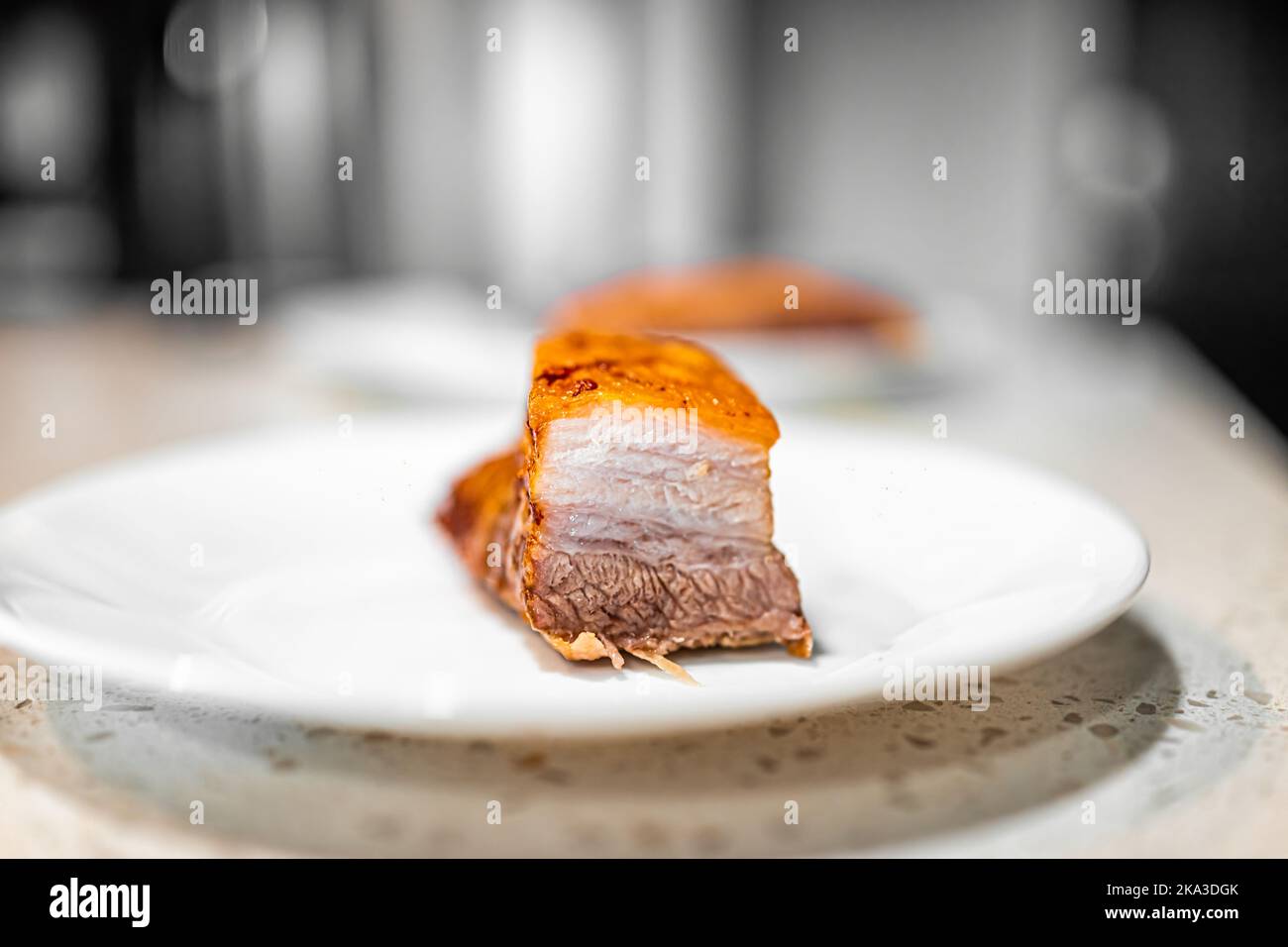 Macro closeup of cut fresh barbecue cooked baked pork belly fat bacon