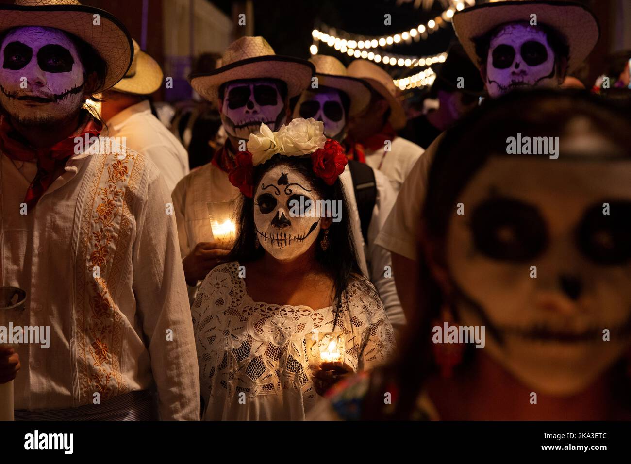 The Paseo de las Ánimas (“Walk of the souls”), a parade that goes from the General Cemetery to Parque de San Juan during Hanal Pixán in Mérida, Yucatán, Mexico on October 28, 2022. Hanal Pixán, which means “food for the souls,” is an ancient Mayan tradition carried out to remember friends and relatives who have passed away. It occurs every year, from October 31 to November 2, when the souls are permitted to return and visit their relatives. Hanal Pixán coincides with the better known Mexican tradition of Día de Muertos or Day of the Dead. It combines elements of Mayan culture and Catholicism. Stock Photo