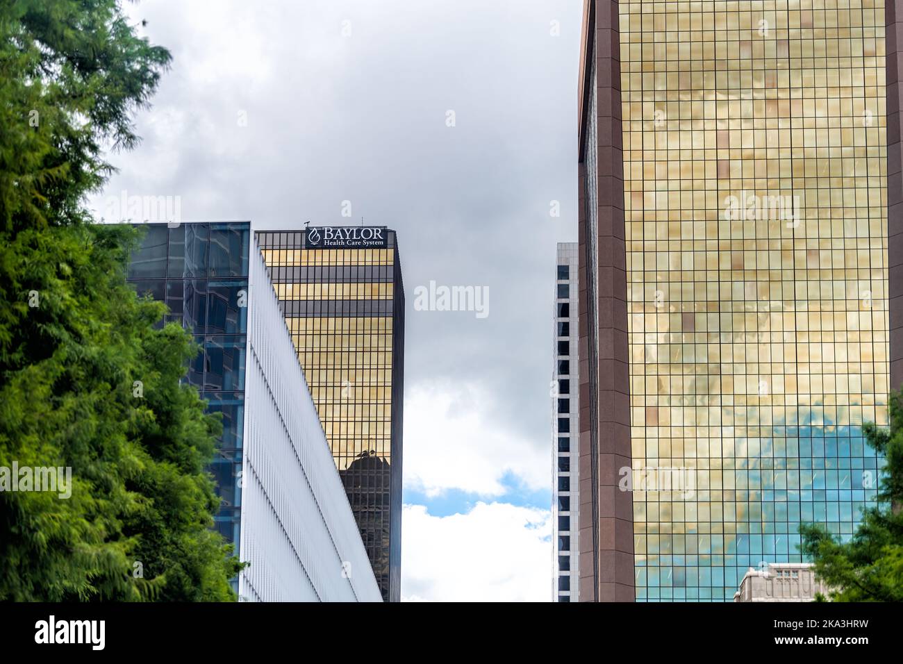 Dallas, USA - June 7, 2019: Downtown cityscape buildings in city with sign on modern architecture office for Baylor Health Care System for Medicine Stock Photo