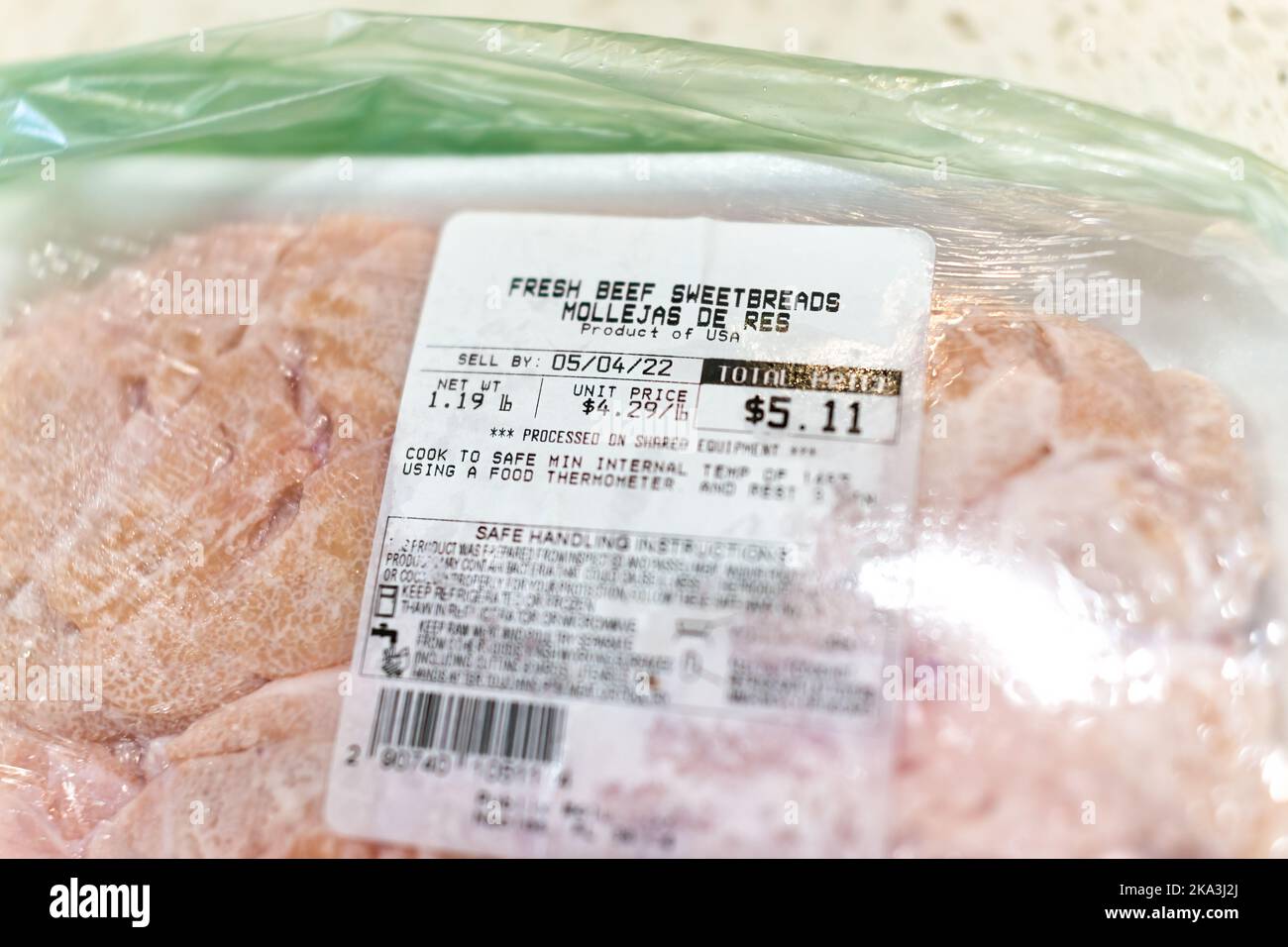 Naples, USA - May 1, 2022: Fresh beef sweetbreads thymus organ gland, nutritious meat food with price tag label sticker per pound in plastic wrap bag Stock Photo