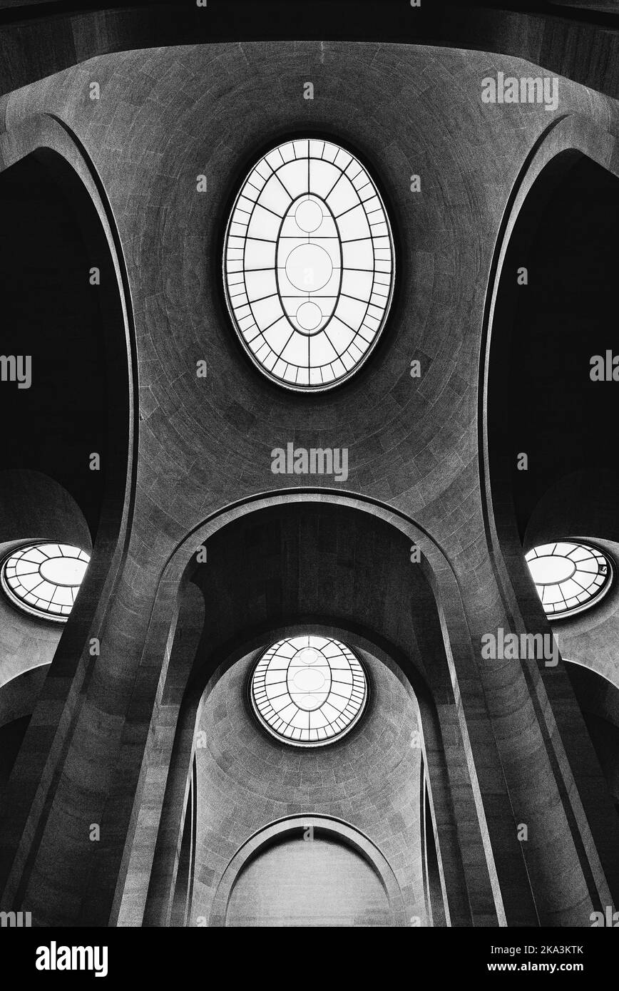 A low angle grayscale of the ceiling details of the famous Louvre Museum Stock Photo