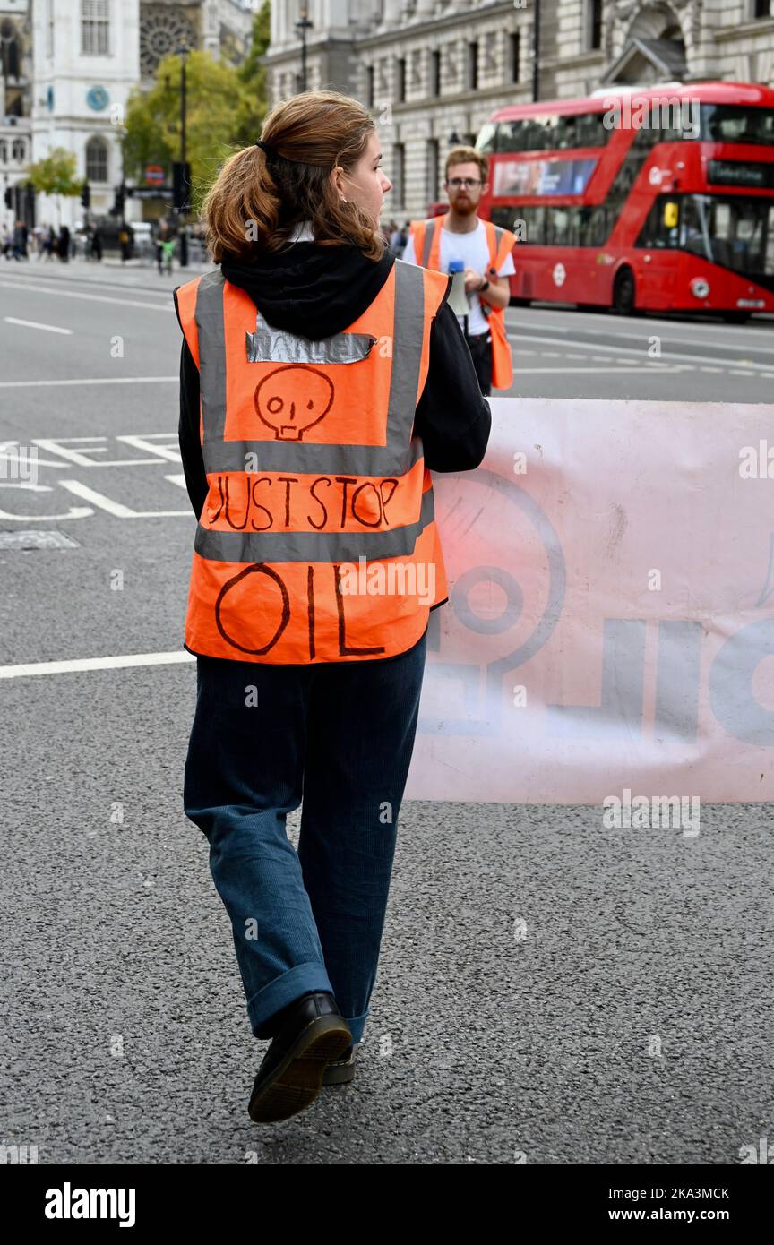 London, UK. 31st Oct, 2022,  Just Stop Oil Activists continued with their demonstrations in Whitehall on day 31 of their campaign. A Just Stop Oil spokesperson was quoted as saying 'We are not prepared to stand by and watch while everything we love is destroyed, while vulnerable people go hungry and fossil fuel companies and the rich profit from our misery.' Stock Photo