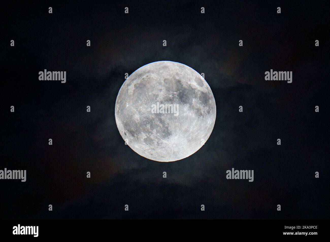 Glowing full moon in a dark sky Stock Photo - Alamy