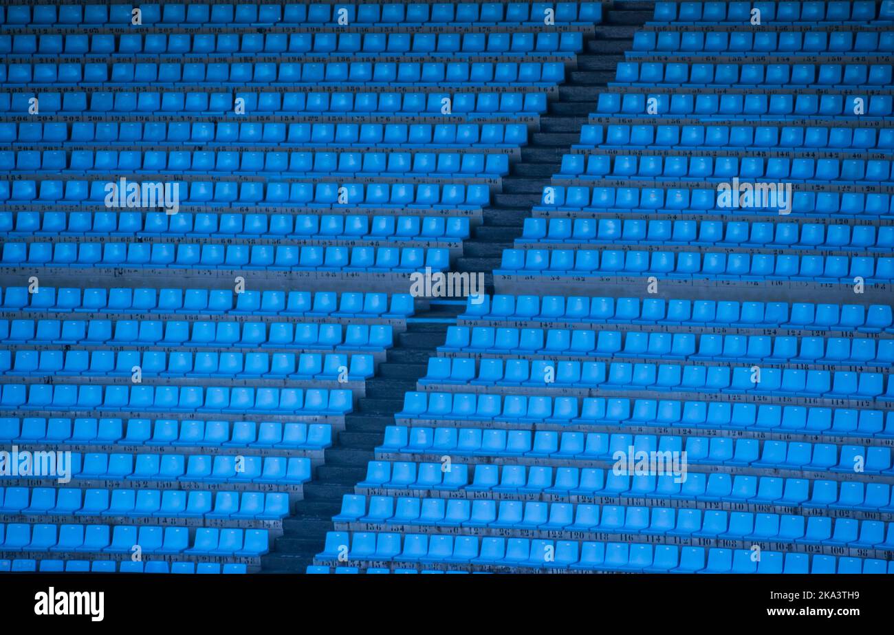 Full frame view of rows of empty blue seats in a sports stadium Stock