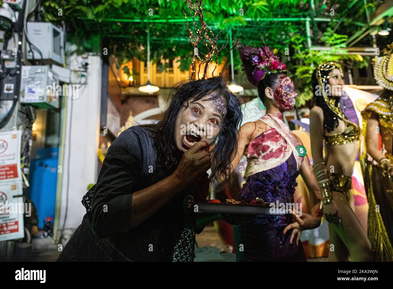 Bangkok, Thailand. 31st Oct, 2022. Party goers dress up in costume for a  Halloween parade on Khaosan Road on October 31, 2022 in Bangkok, Thailand.  This is the first time since the