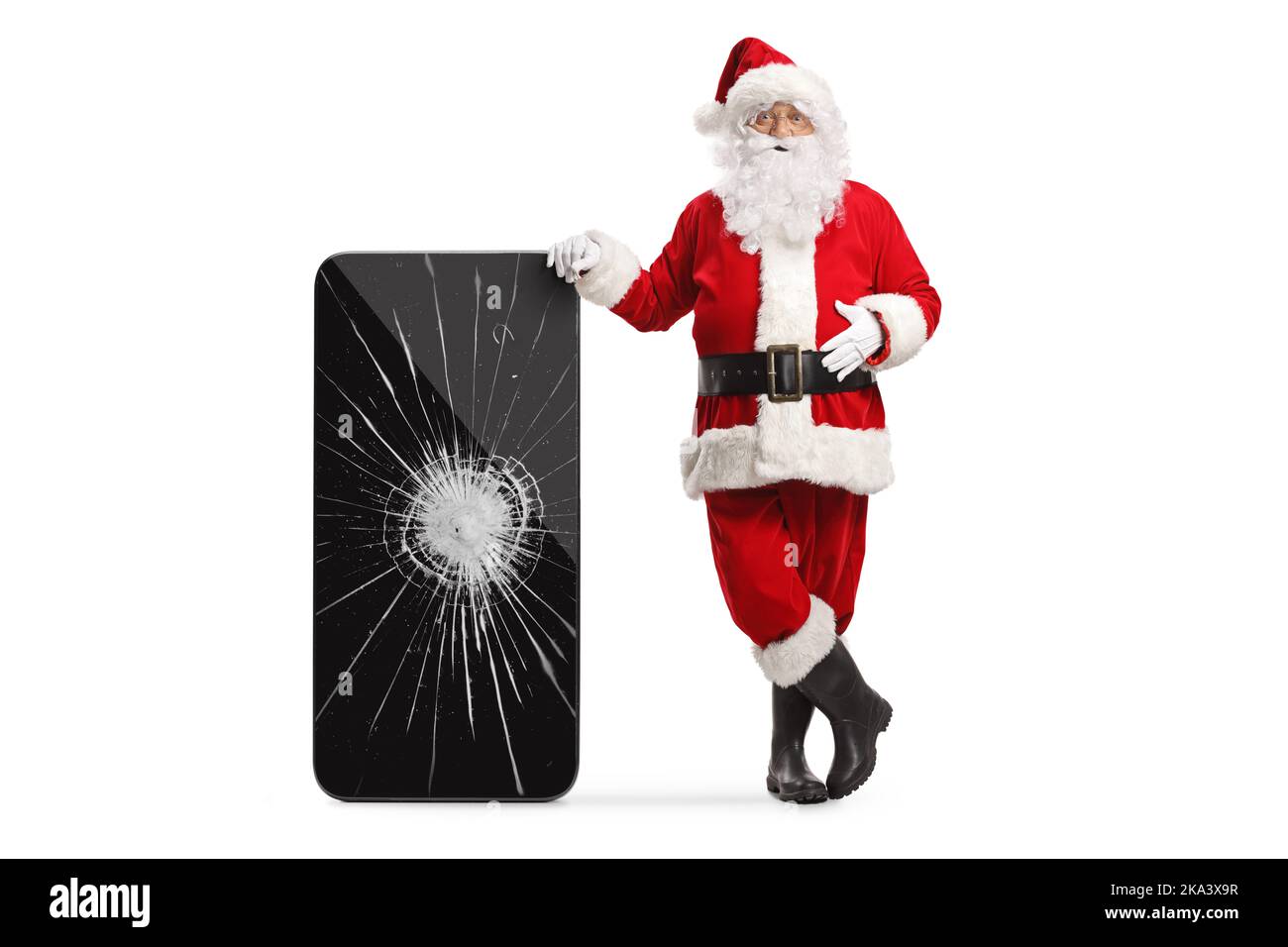 Santa claus leaning on a smartphone with cracked screen isolated on white background Stock Photo