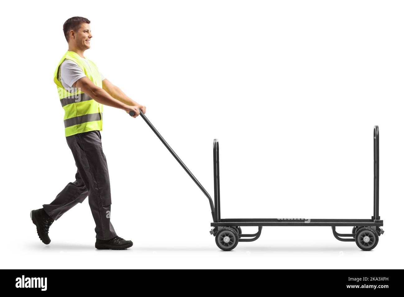 Airport worker pushing a luggage cart isolated on white background
