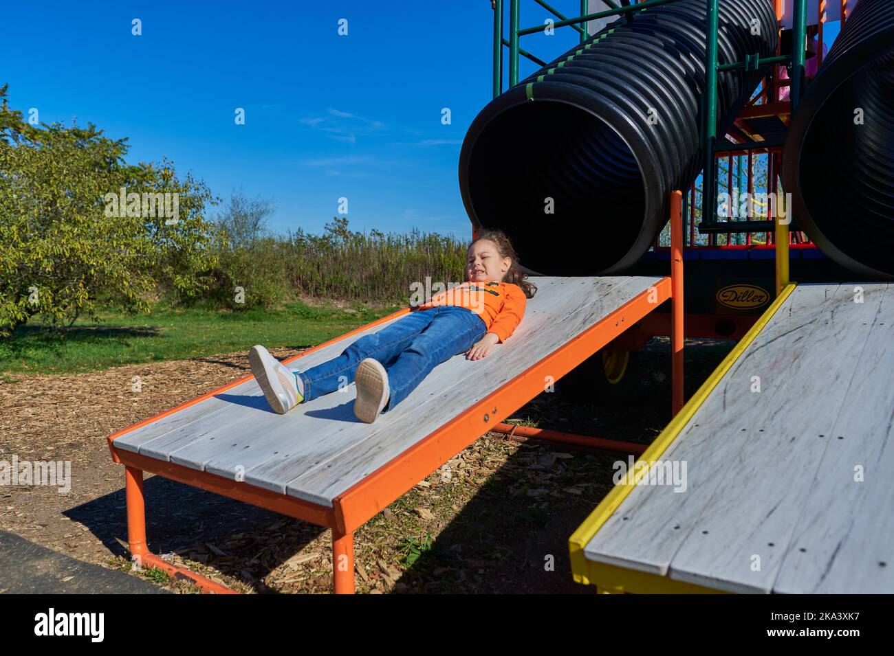 Girl sliding down the slide hi-res stock photography and images - Alamy