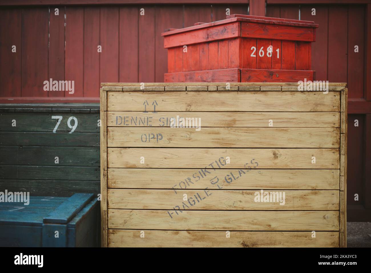 Four multi coloured wooden shipping crates Stock Photo Alamy