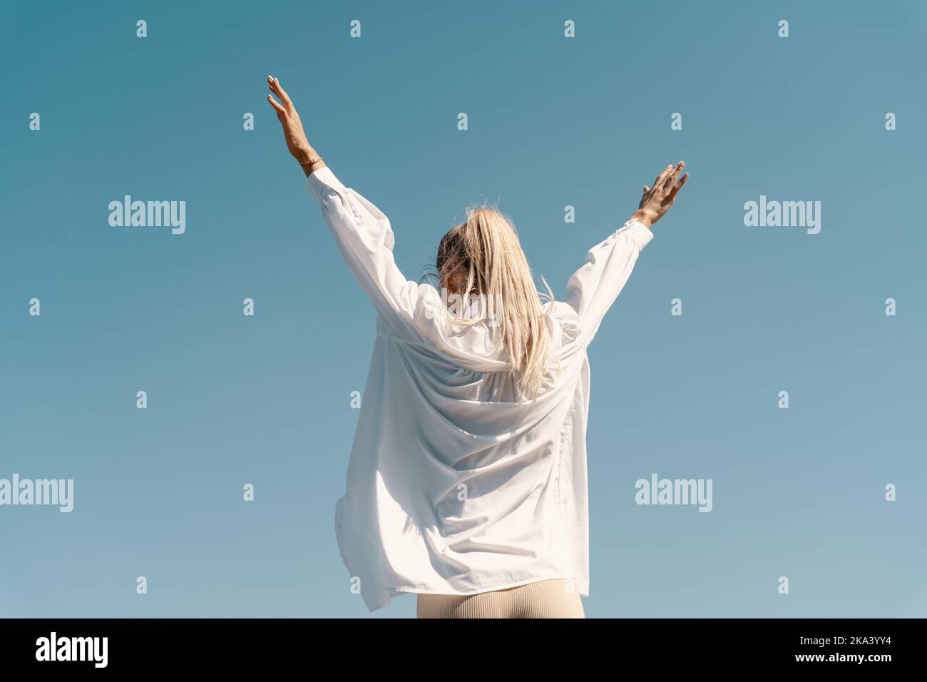 Blonde woman dancing rear view hi-res stock photography and images - Alamy