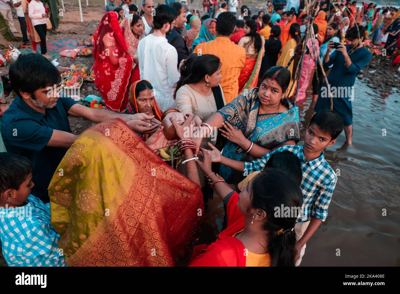 Devotees offering prayers to God during Chhath Puja festival in ...