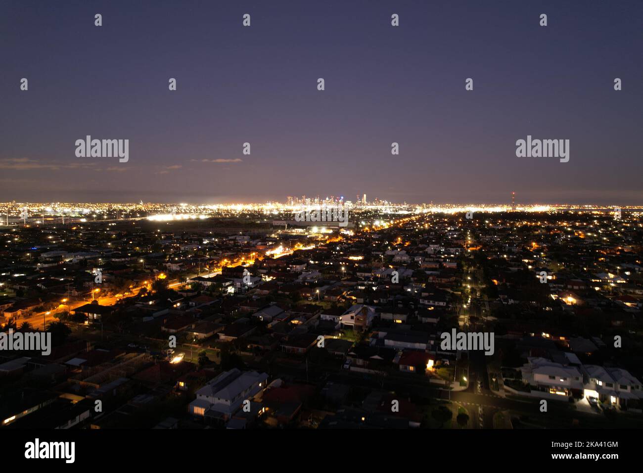 An aerial view of a night over a beautiful city with illuminated street ...