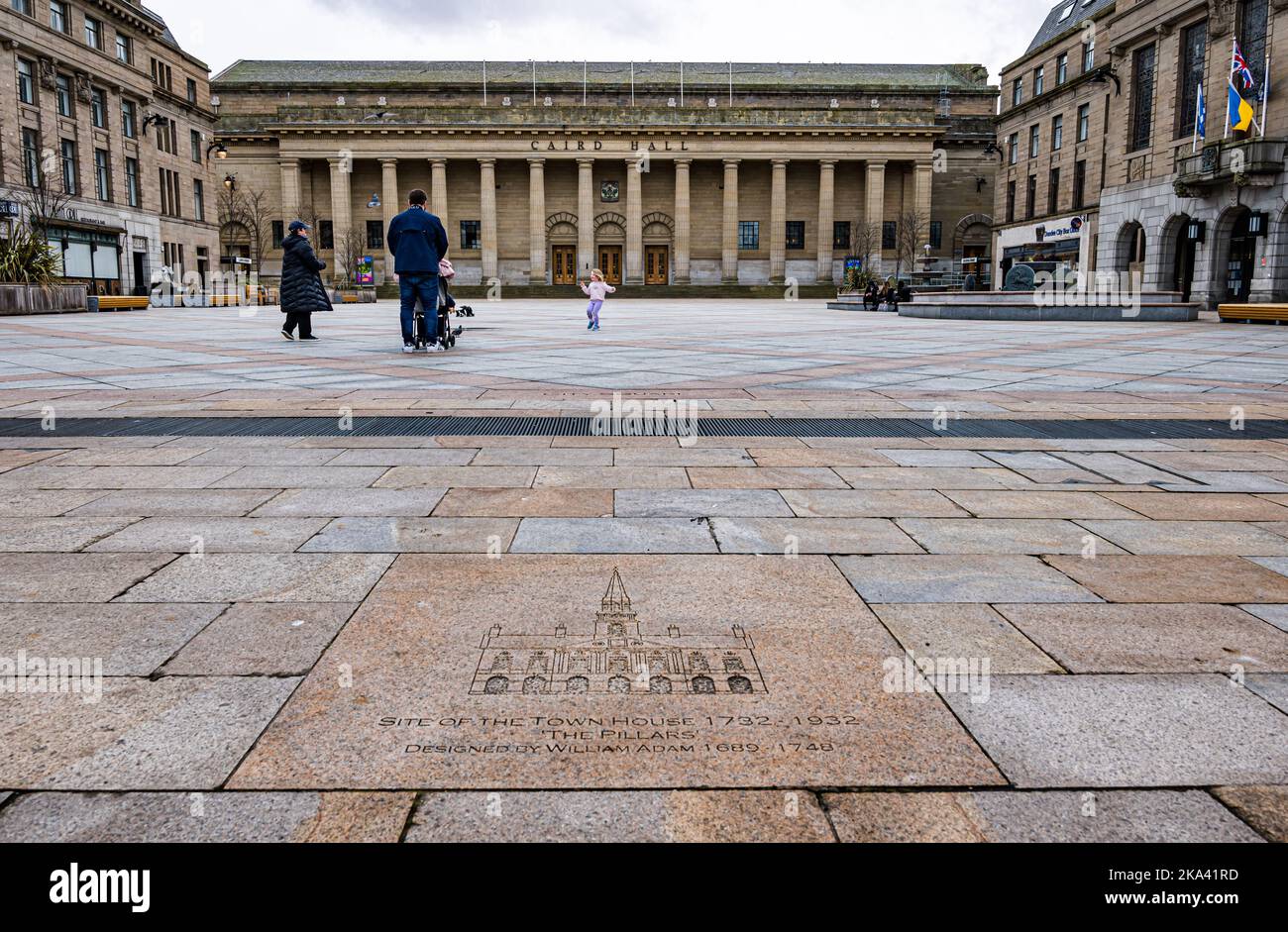 Caird Hall concert venue with William Adam flagstone inscription and child running in square, Dundee city centre, Scotland, UK Stock Photo