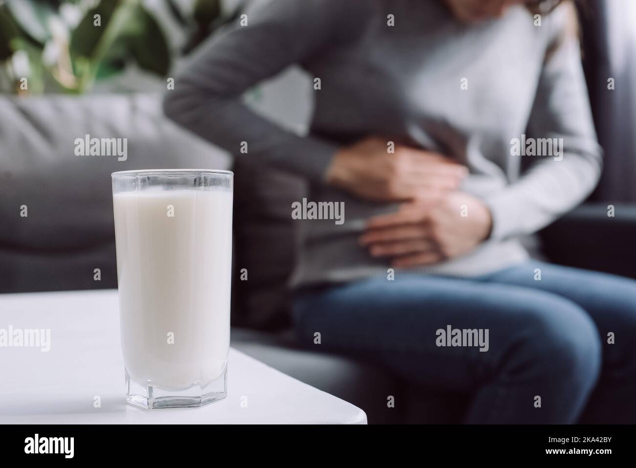 Lactose intolerance, food allergy concept. Selective focus of glass