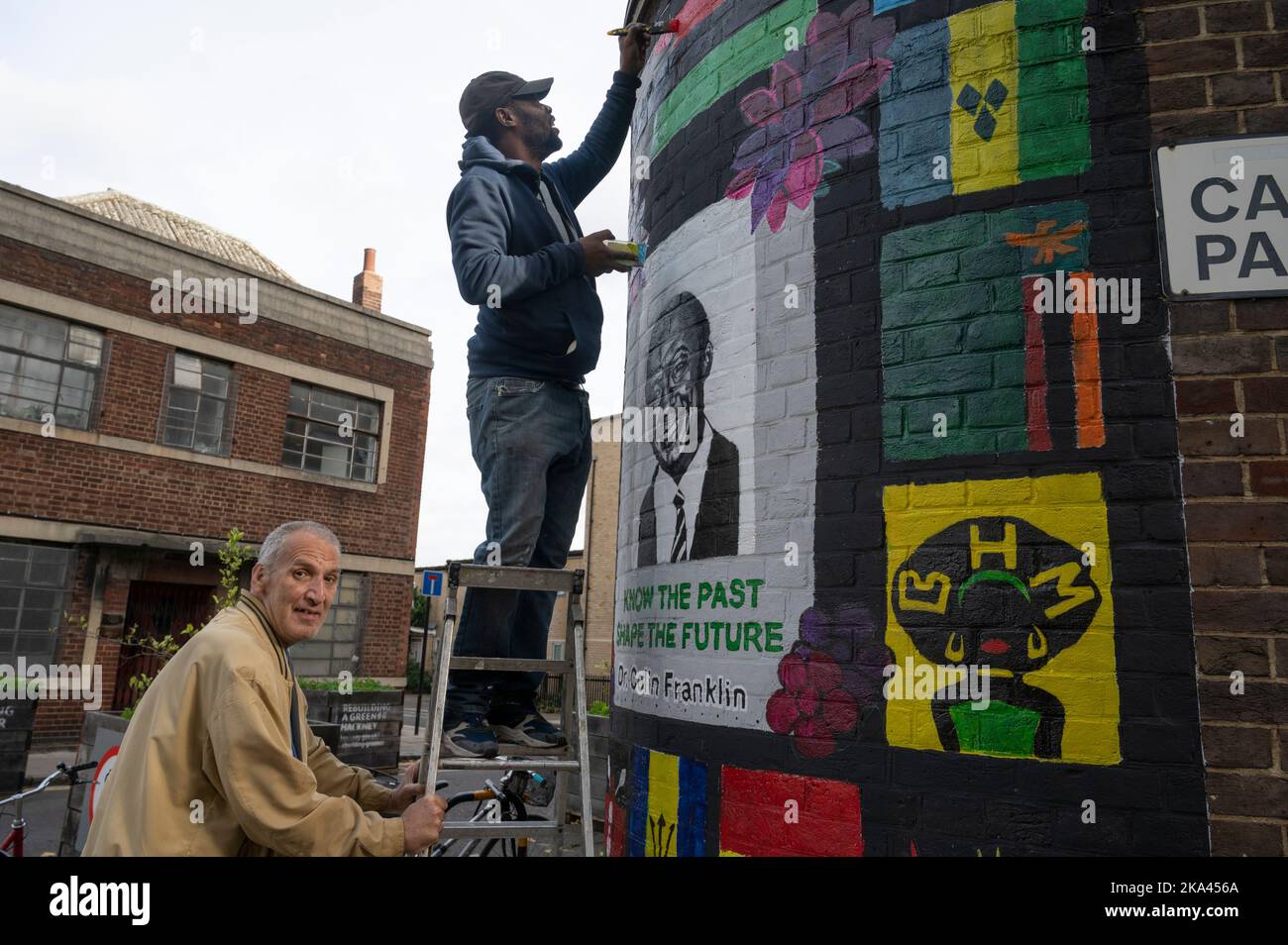 Unveiling of Black History Month mural outside Elsdale Street surgery, Hackney, honouring Dr Colin Franklin  one of the first Black doctors in Hackney Stock Photo