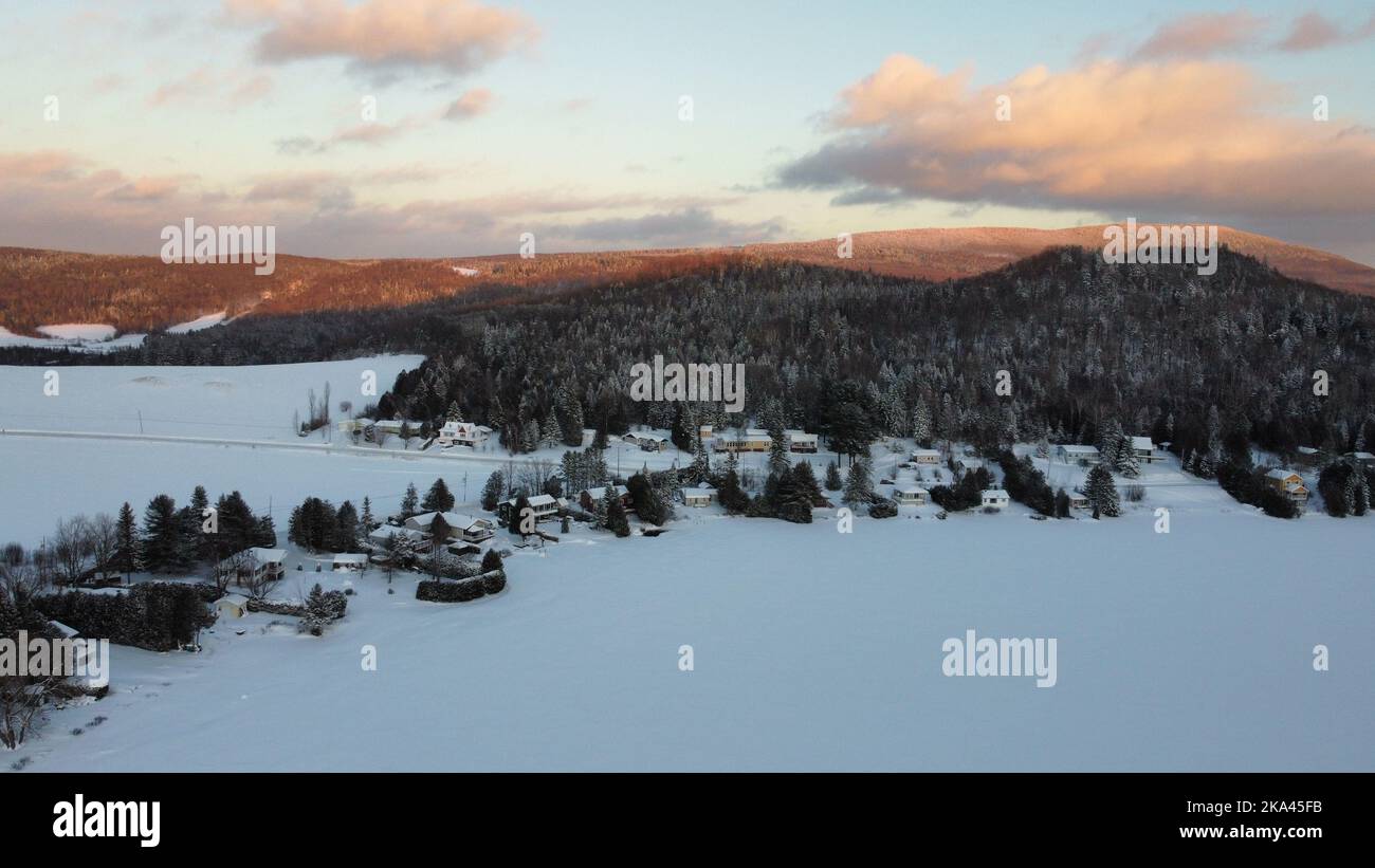 An aerial view of snowy houses and forest trees Stock Photo - Alamy