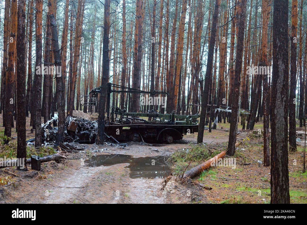 KHARKIV REGION, UKRAINE - OCTOBER 26, 2022 - A burnt-out Russian charger for a BM-21 Grad multiple rocket launcher is pictured in a forest near Izium Stock Photo