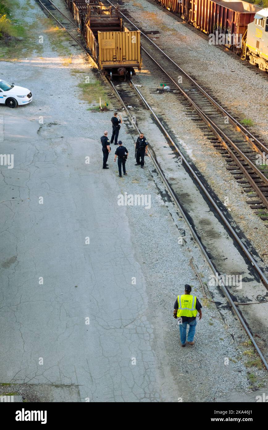 Metro police stand by the railroad tracks, responding to a reported crime in downtown Nashville, Tennessee. Stock Photo