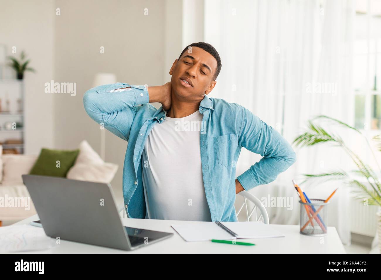 Sad young african american man use computer for study, work, suffering ...