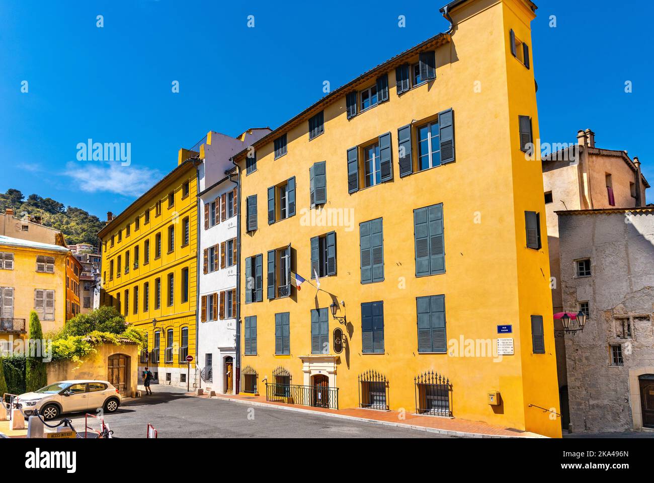Grasse, France - August 6, 2022: Historic medieval tenement houses at Place du Petit Puy square in old town quarter of perfumery city of Grasse Stock Photo