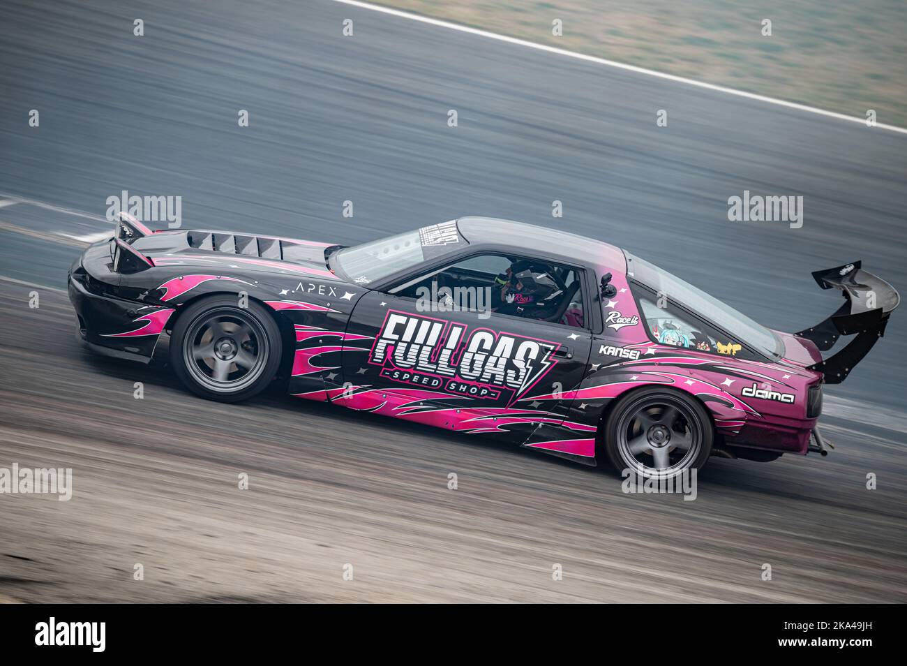 Toyota Supra with pink vinyl drifting Stock Photo