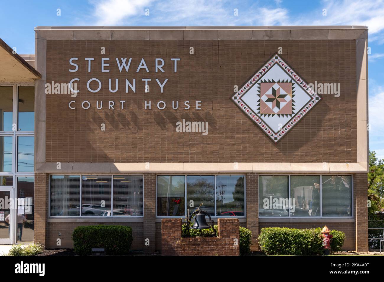 Stewart County Courthouse in Tennessee with a quilt block on the front of the building. Stock Photo