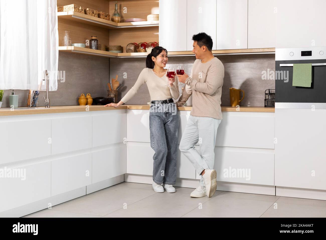 Happy asian couple celebrating hi res stock photography and images Alamy