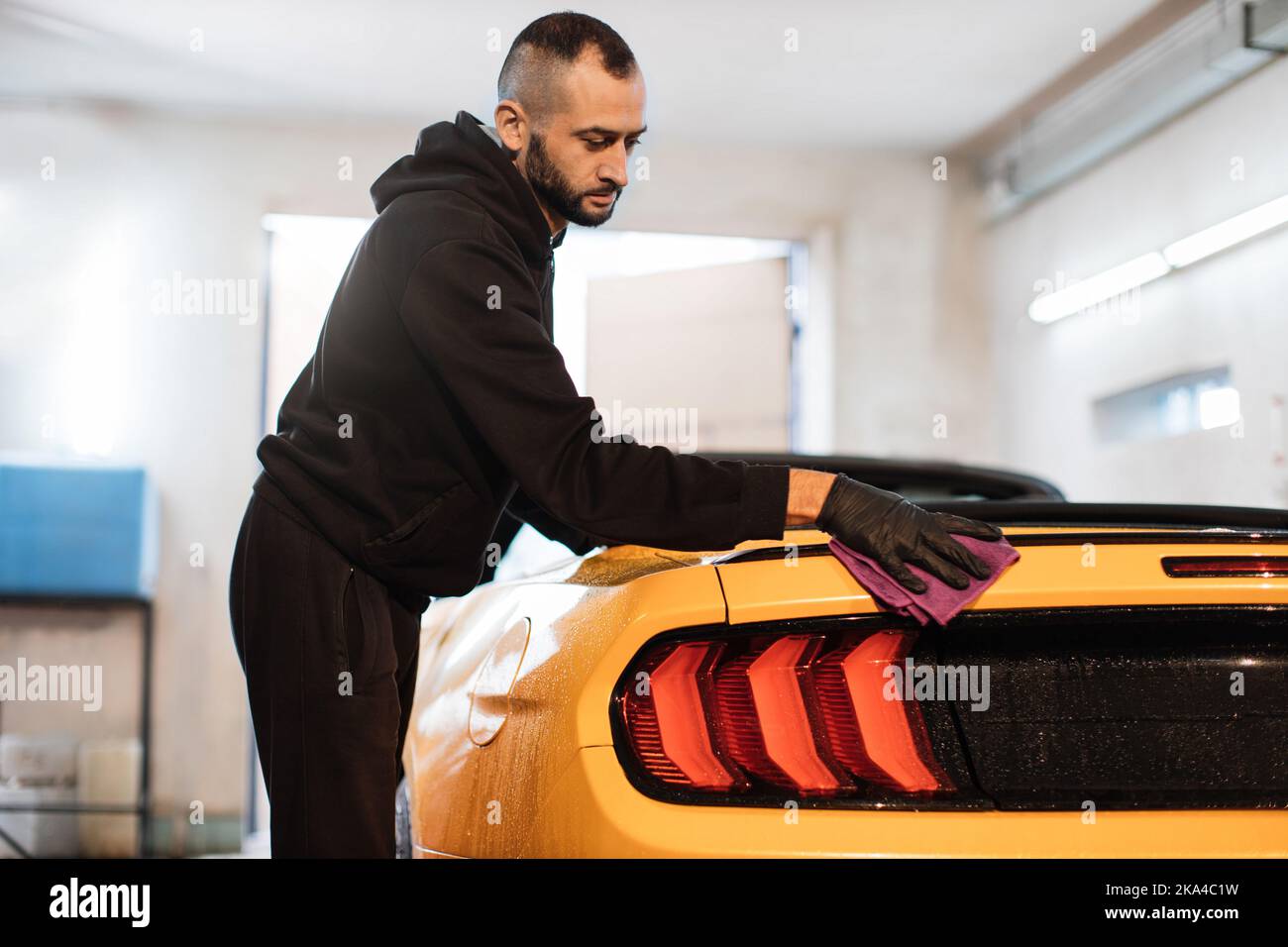 View from tail lights of vehicle. Car detailing and cleaning concept