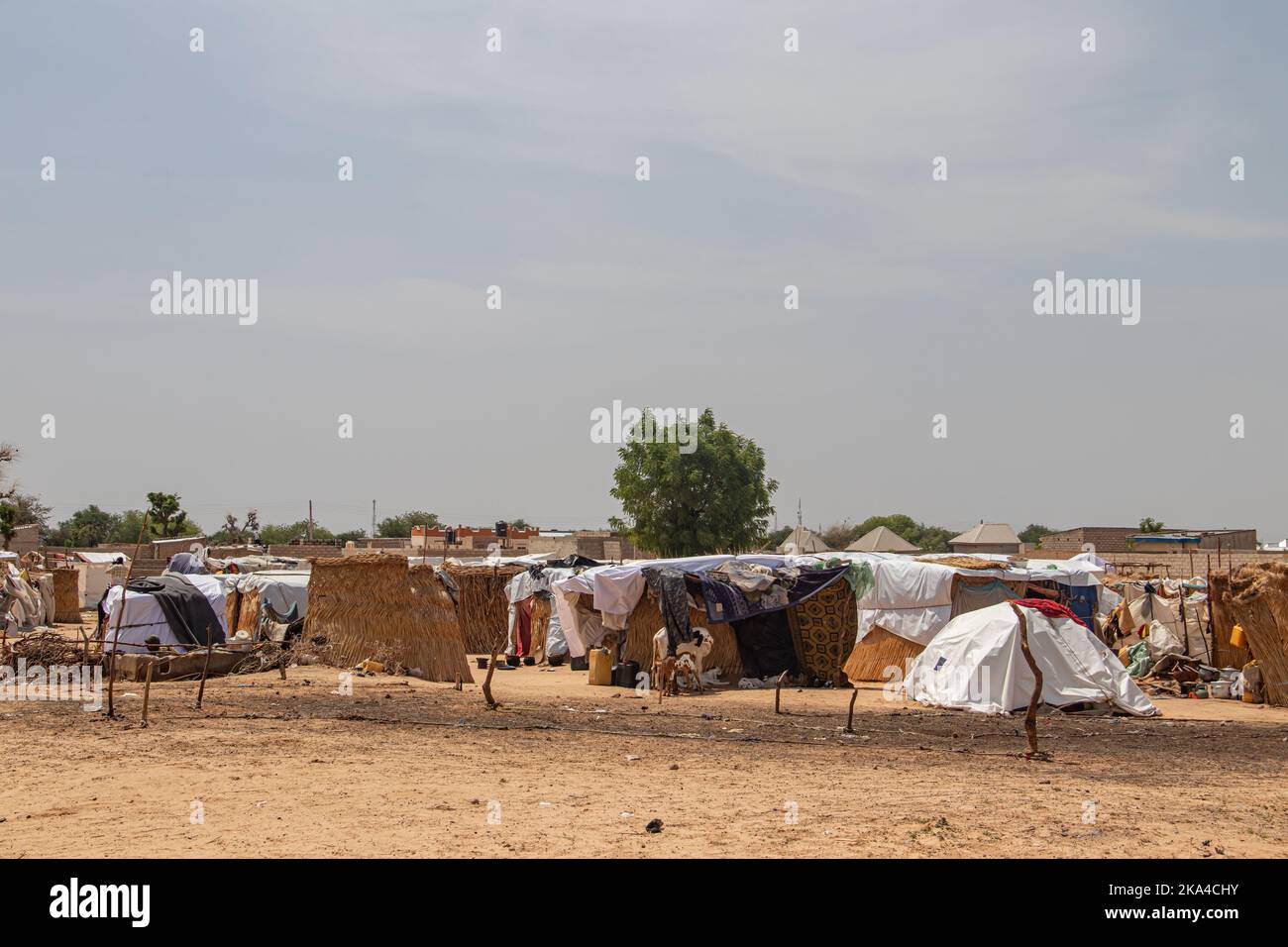 Refugee camp in Africa, full of people who took refuge due to insecurity and armed conflict. People living in very poor conditions Stock Photo