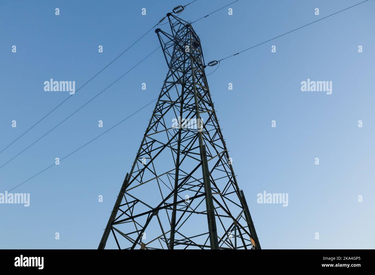 A low angle shot of a tall steel tower under the blue sky Stock Photo ...