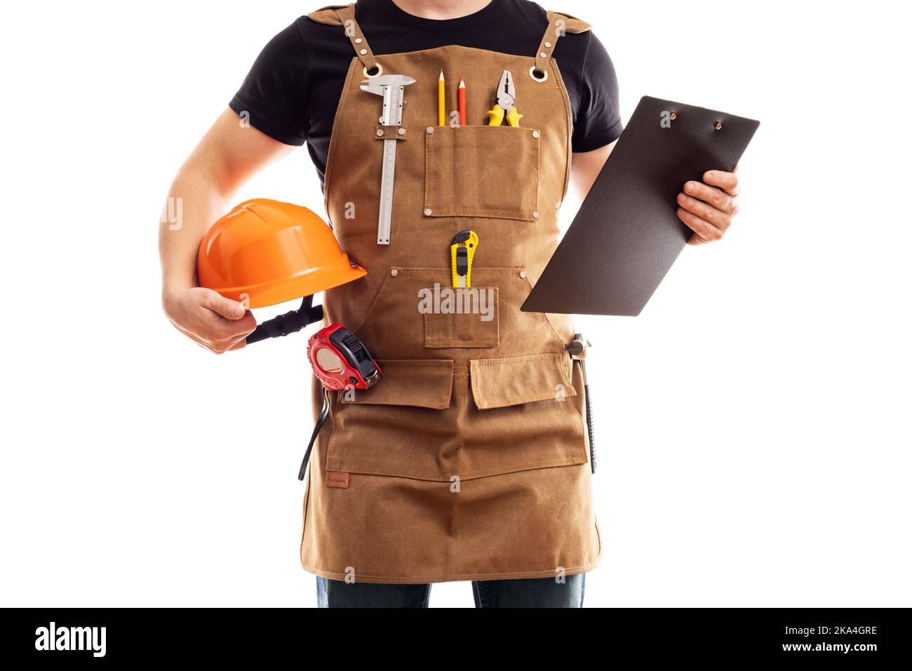 Carpenter in workers apron with hard hat and clipboard on white