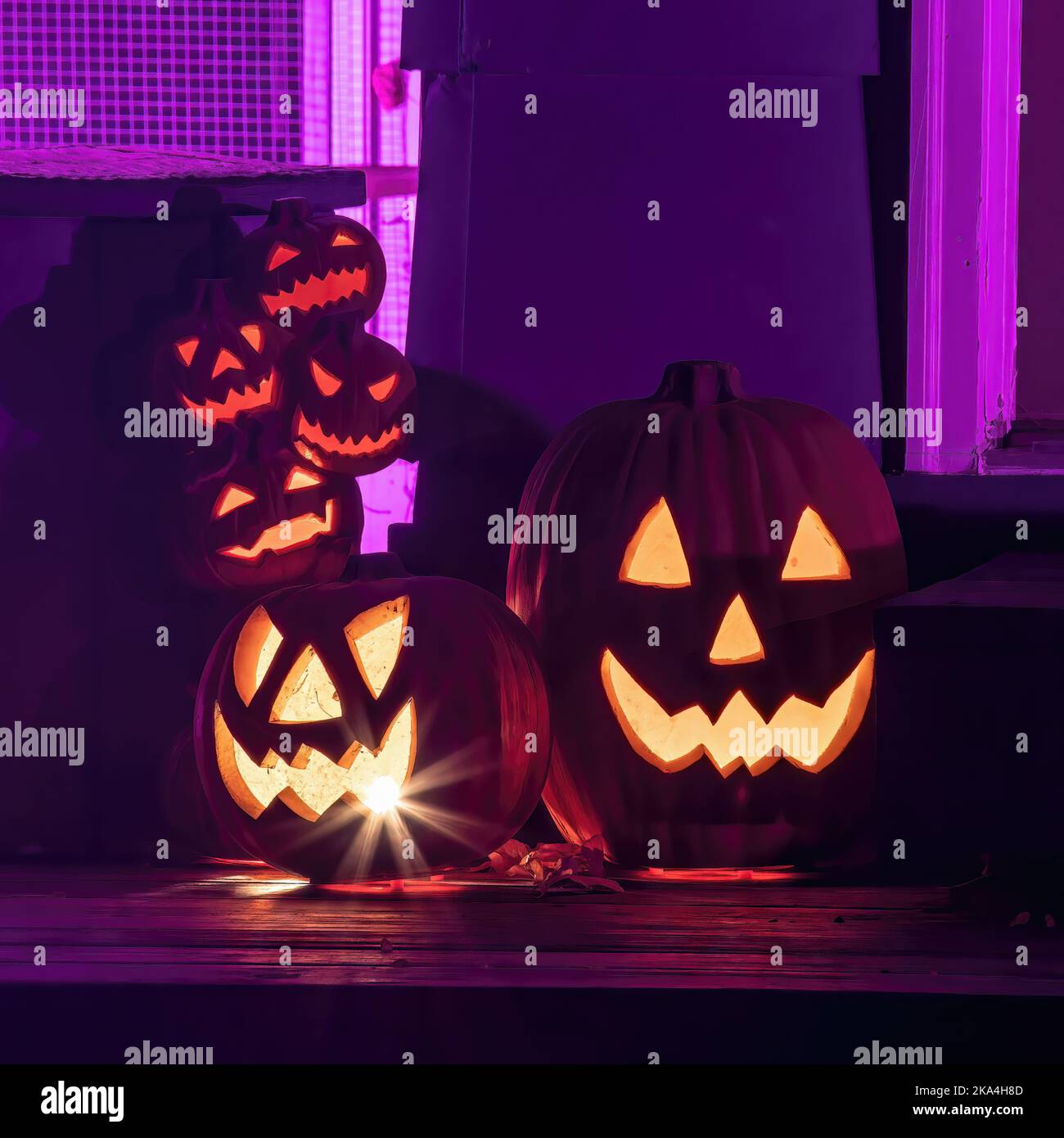 Lighted pumpkins in an eerie pink light to celebrate Halloween in St ...