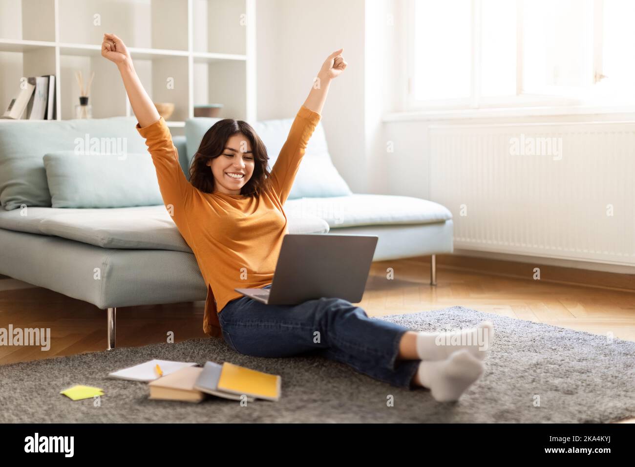 Happy Middle Eastern Female Student Celebrating Success With Laptop At ...
