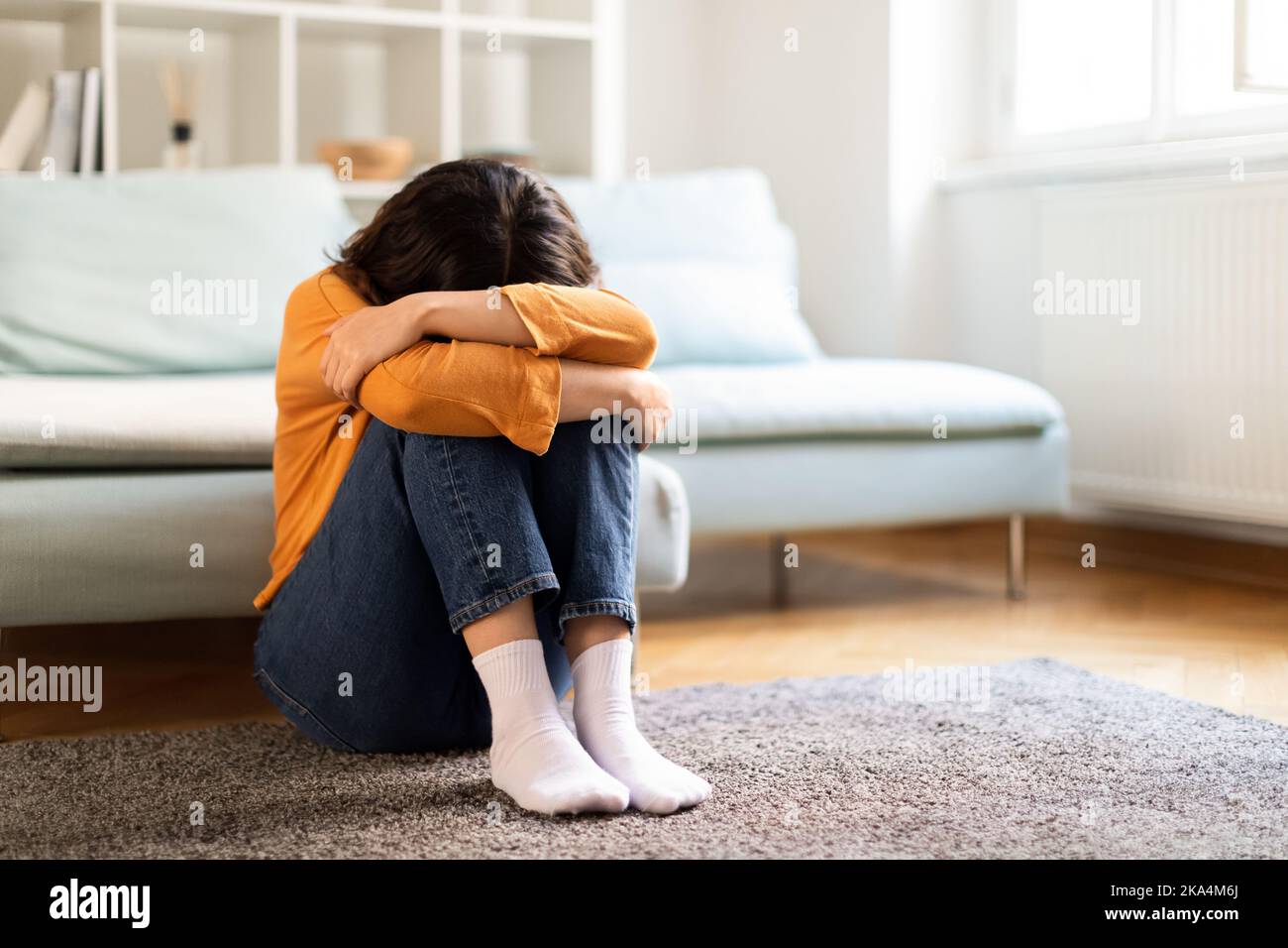 Depression Concept. Portrait Of Upset Young Middle Eastern Woman Crying At Home Stock Photo
