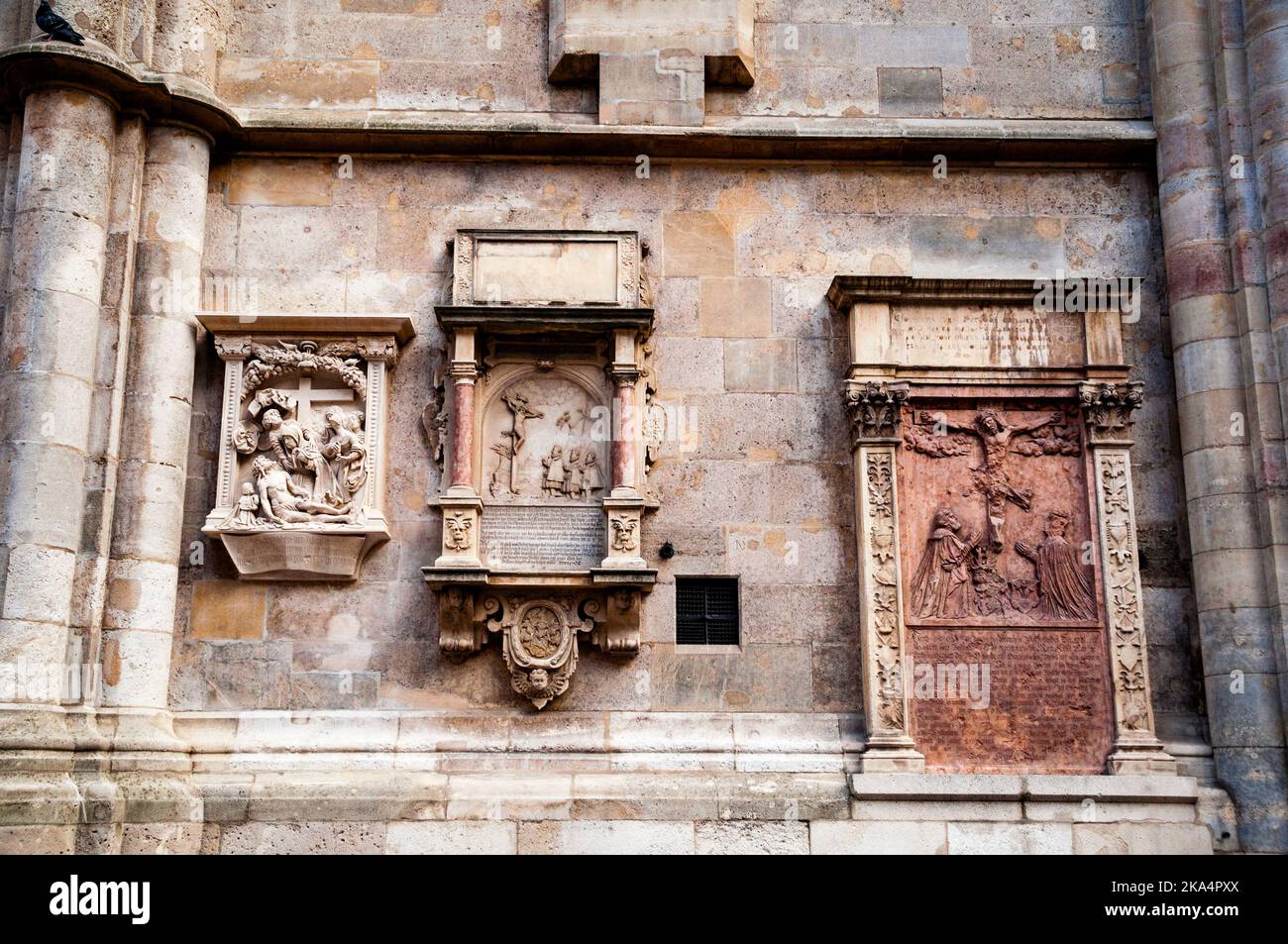 Romanesque bas-relief crucifixion scenes on the West front of St. Stephen's Cathedral in Vienna, Austria. Stock Photo