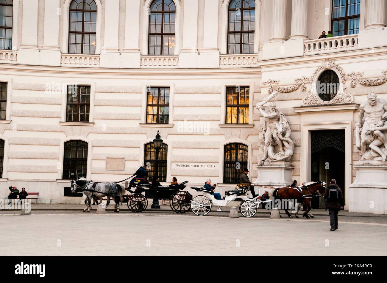 Viennese Fiakers two-horse drawn carriages are a part of the landscape of the capitol city in Austria. Stock Photo